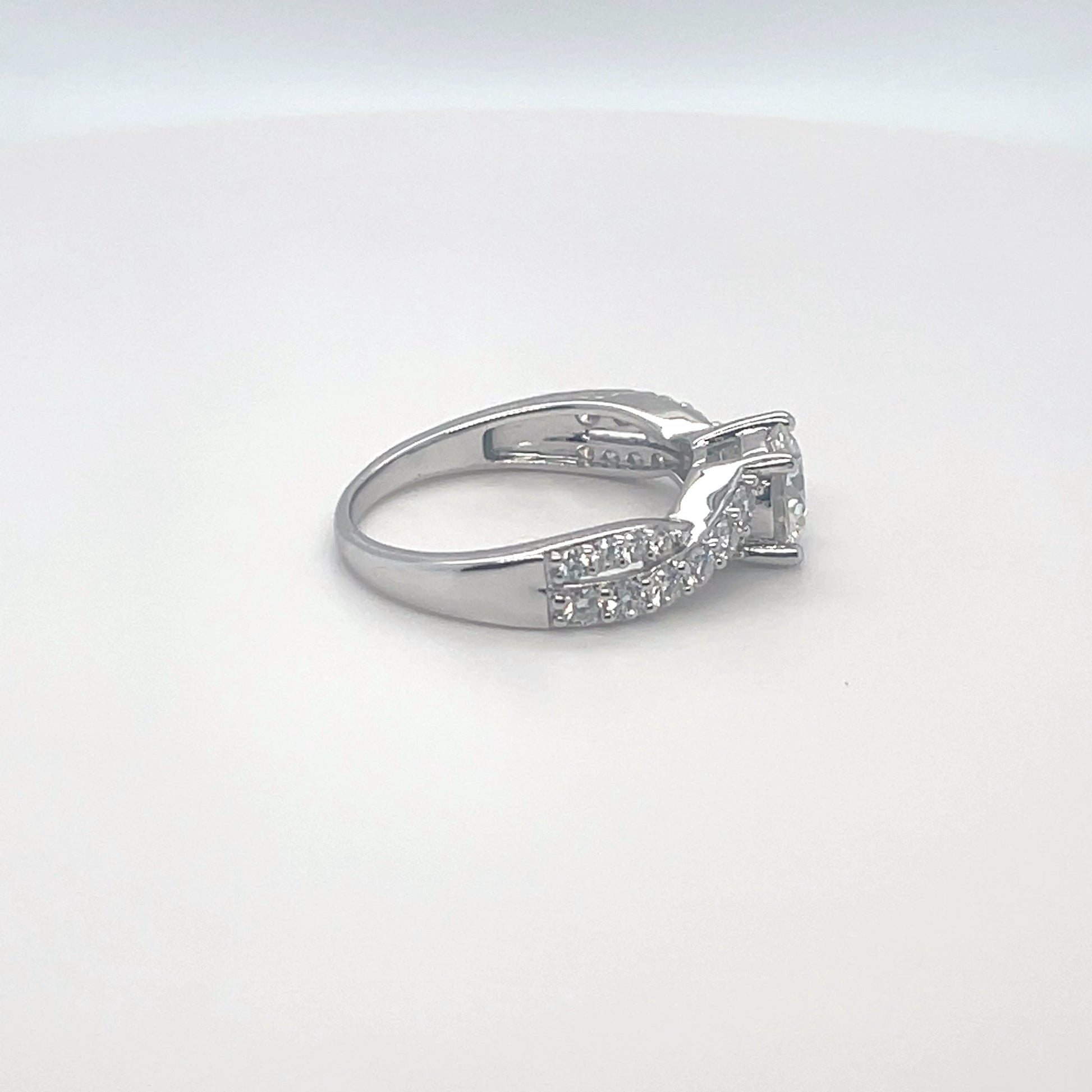 TTT Rhodium Plated, Sterling Silver Twisted Ring w/1 Ct Round & Moissanite Gemstone Accents.-WH